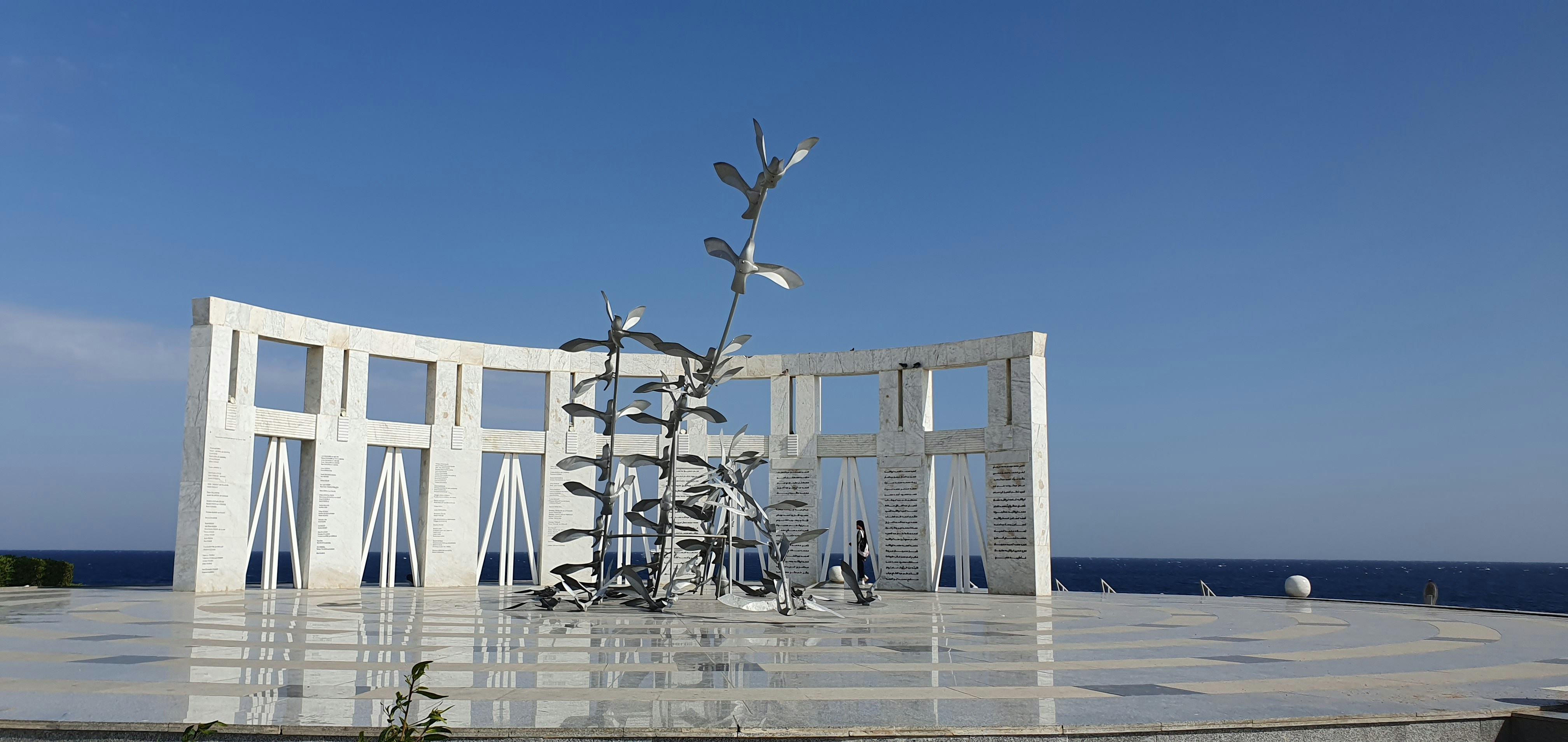 a sculpture of a flower in a circular area