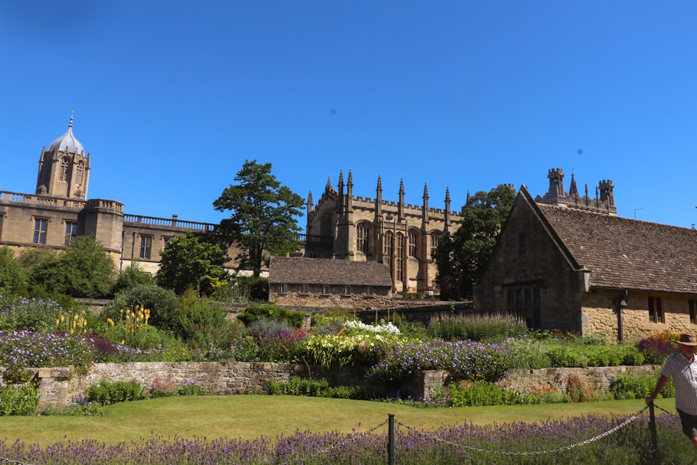 a large building with a garden in front of it