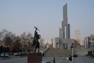 a statue of a man with a cross on his shoulder