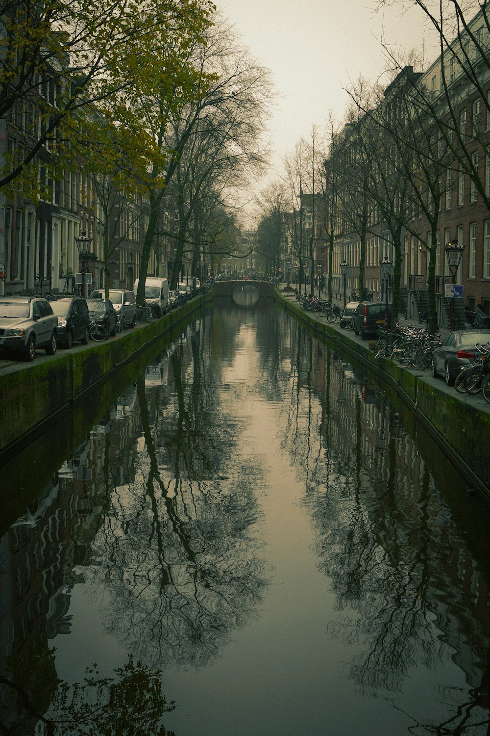 a river running through a city next to tall buildings