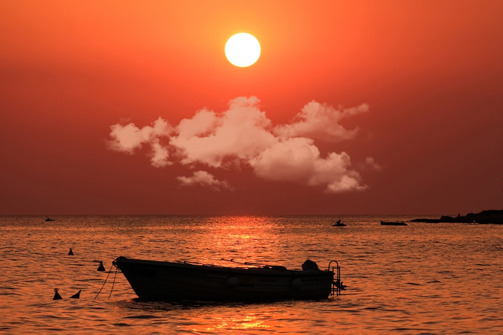 a boat floating on top of a body of water