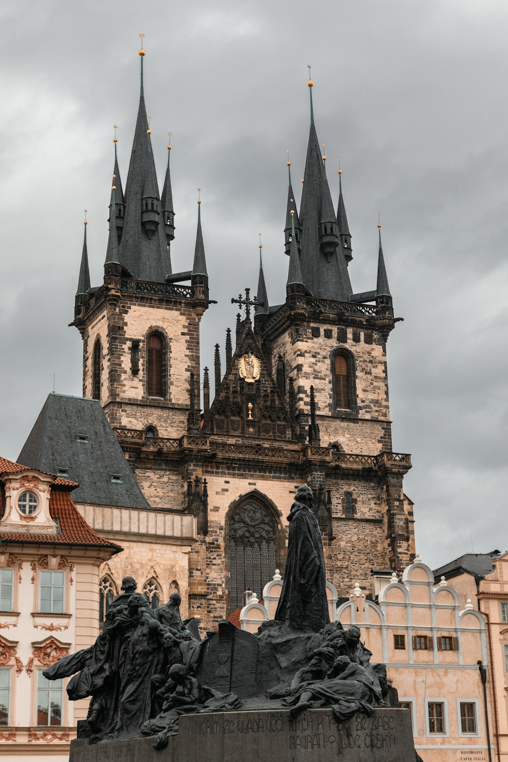 a statue of a man on a horse in front of a building