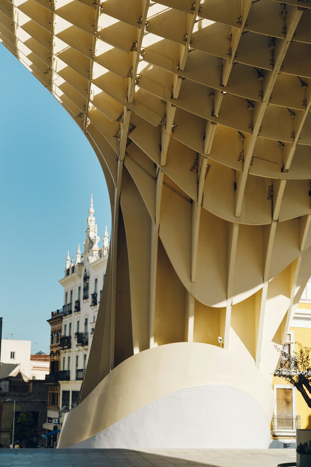 a large white structure with a clock tower in the background