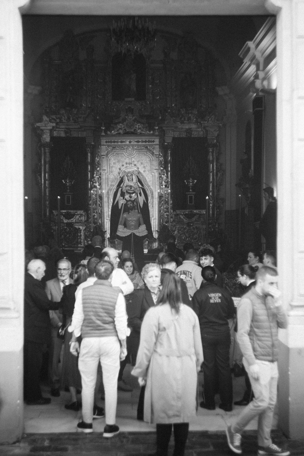 a group of people standing in front of a church