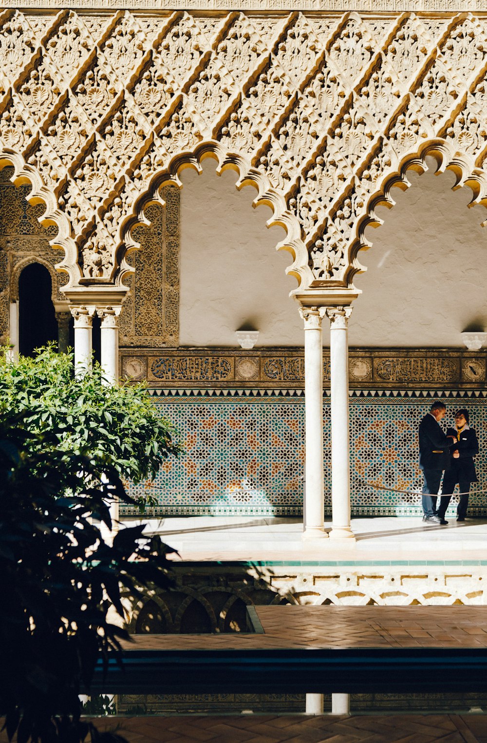 a couple of people that are standing in front of a building