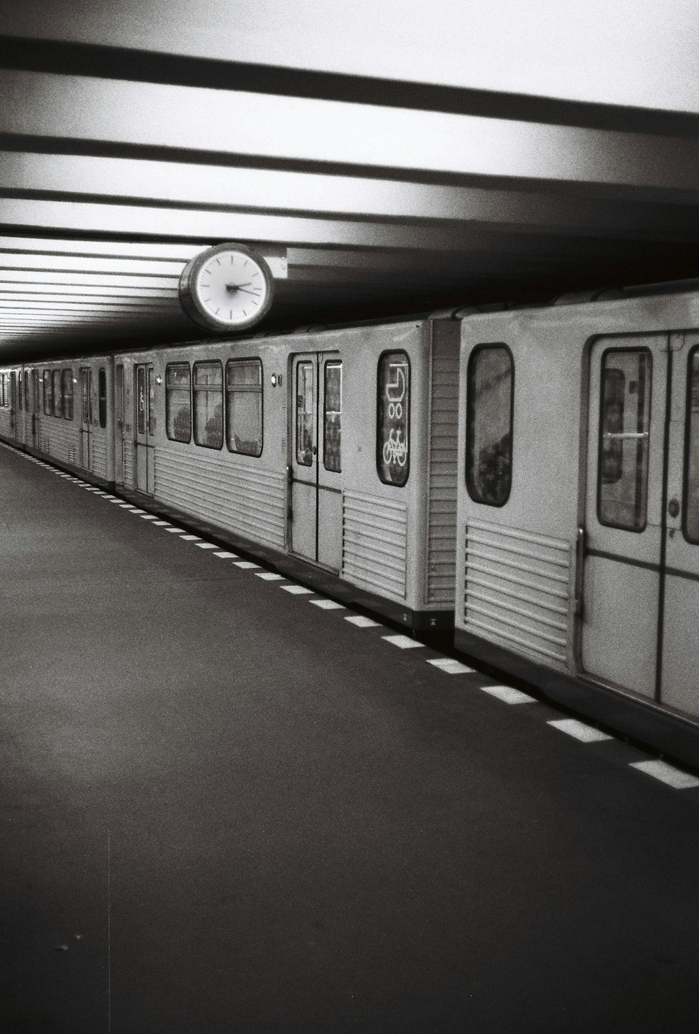 a black and white photo of a subway train