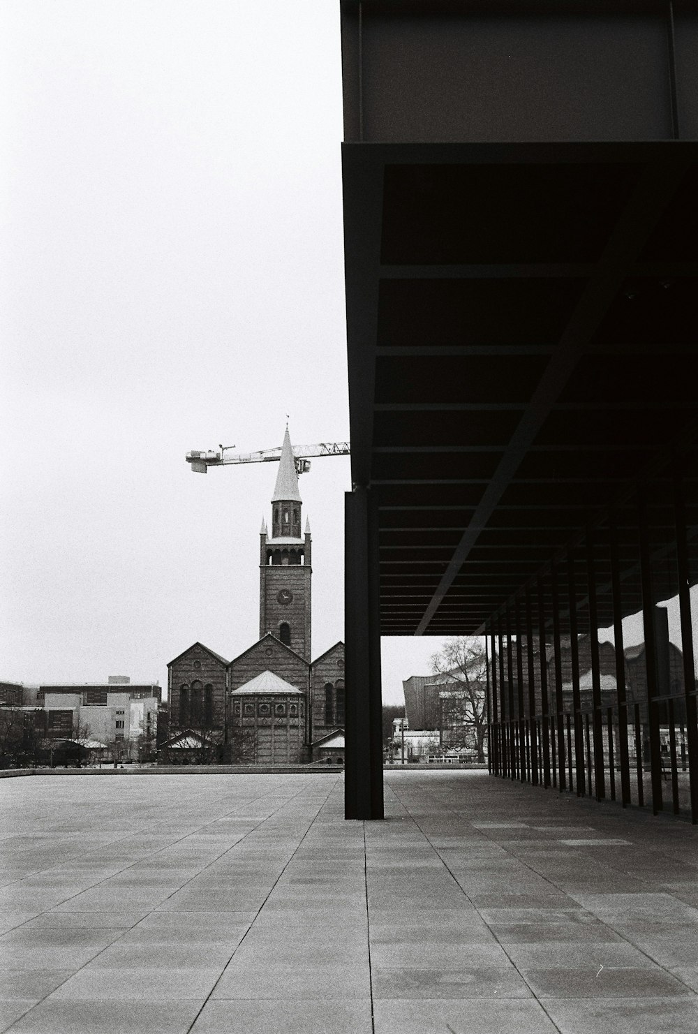 a black and white photo of a building under construction