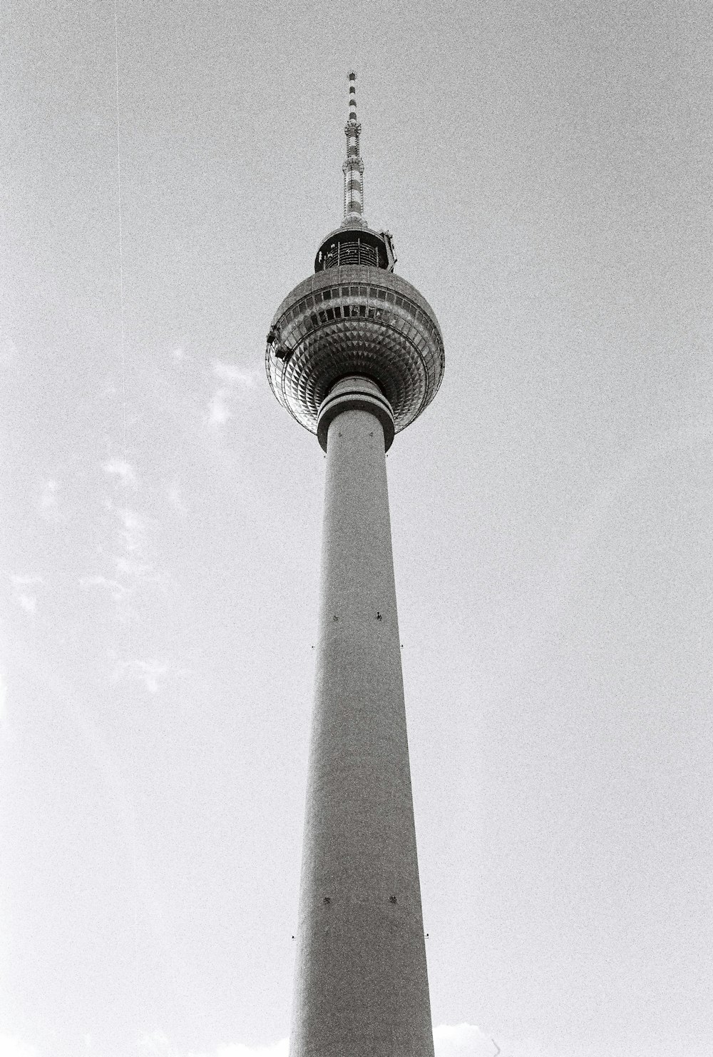 a black and white photo of a tall tower