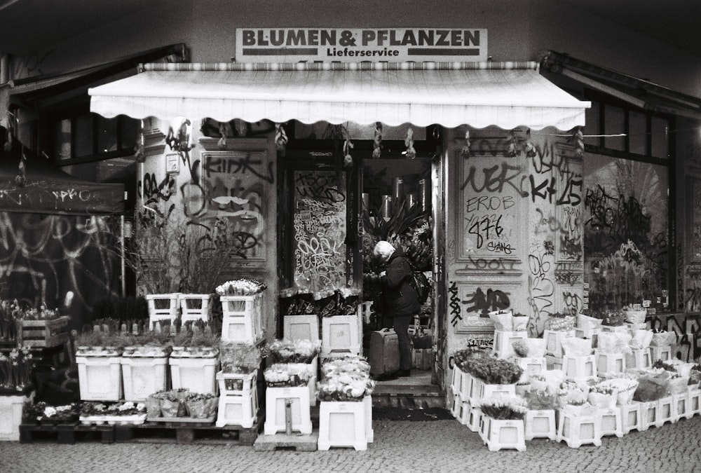 a black and white photo of a store front