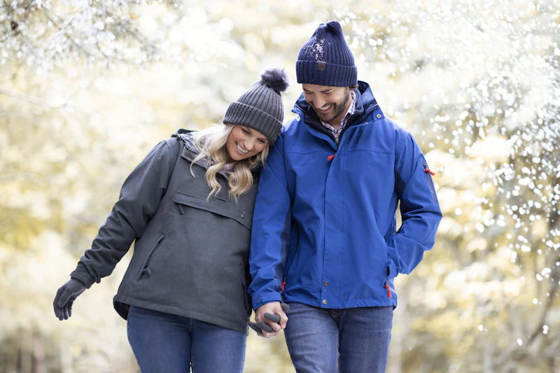 mature couple walking through a park