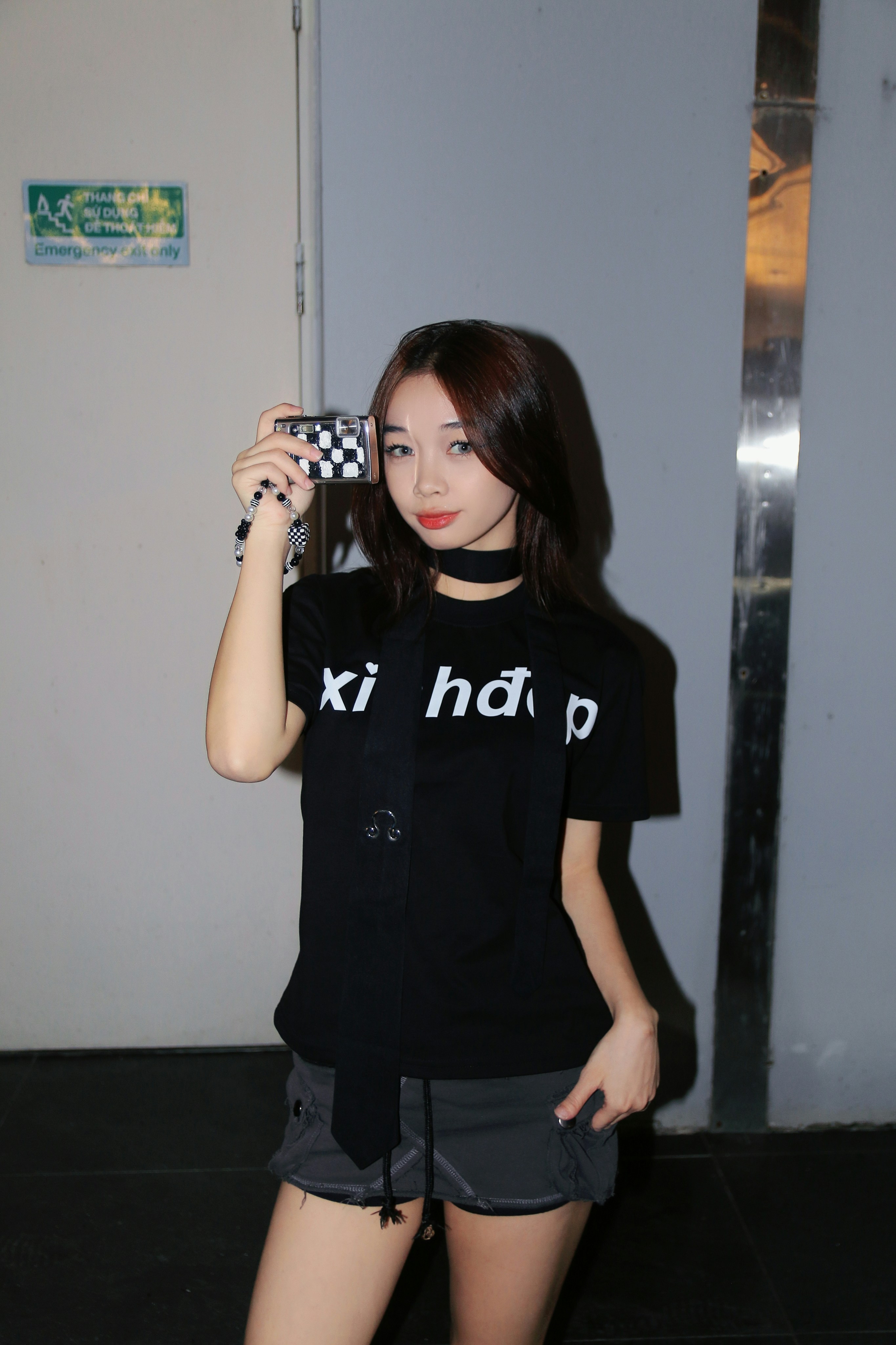 a woman taking a picture of herself with her cell phone