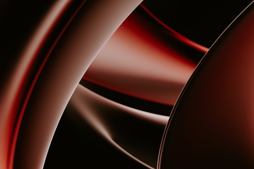 uno sfondo astratto nero e rosso con curve