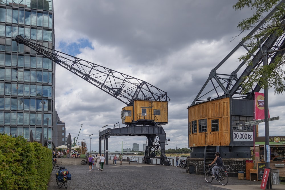 a large crane sitting next to a tall building