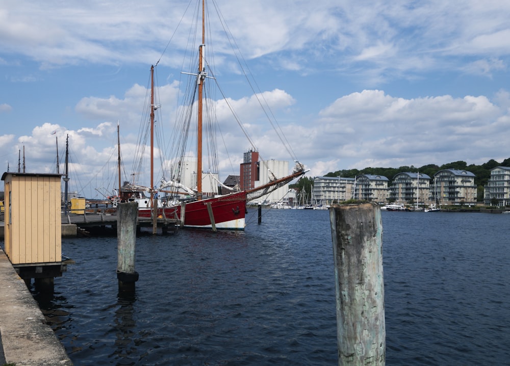 a boat is docked at a dock in the water