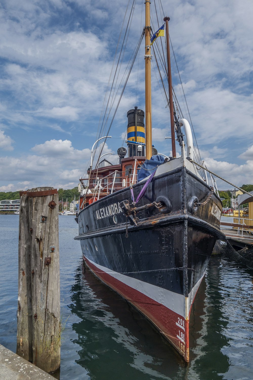 a large boat is docked at a dock