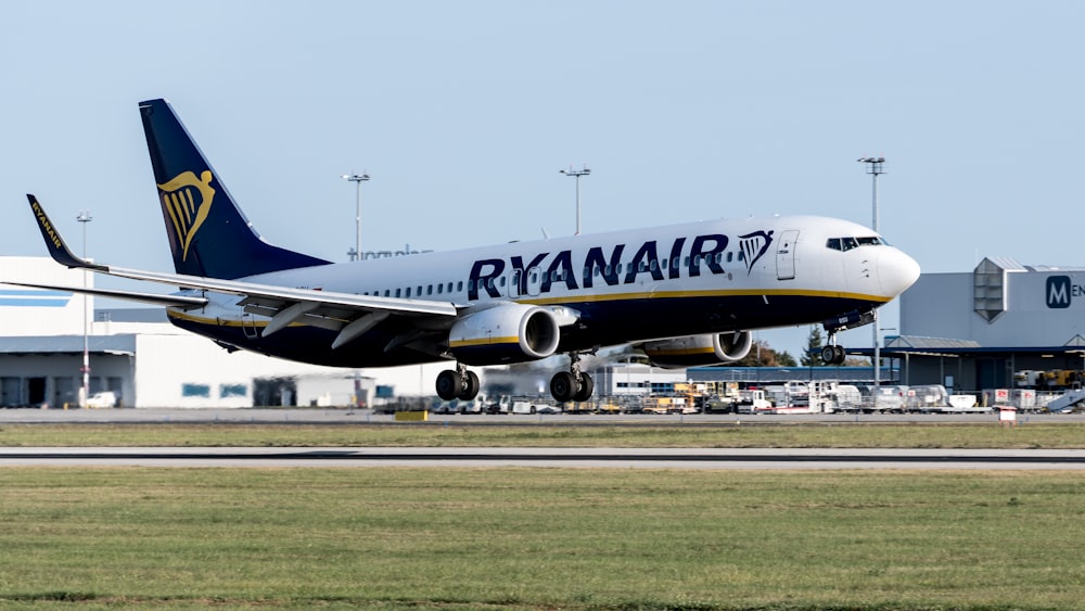 a large jetliner sitting on top of an airport runway