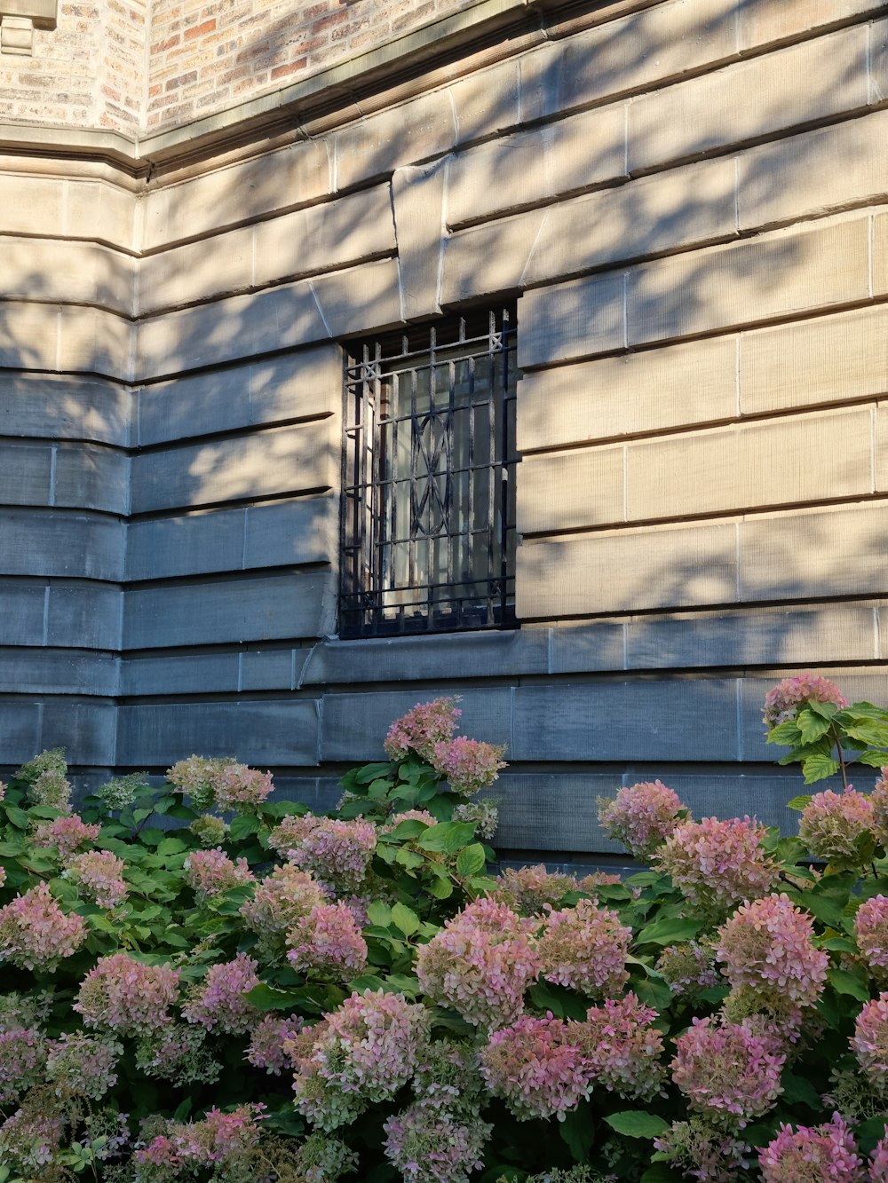 a building with a bunch of flowers in front of it