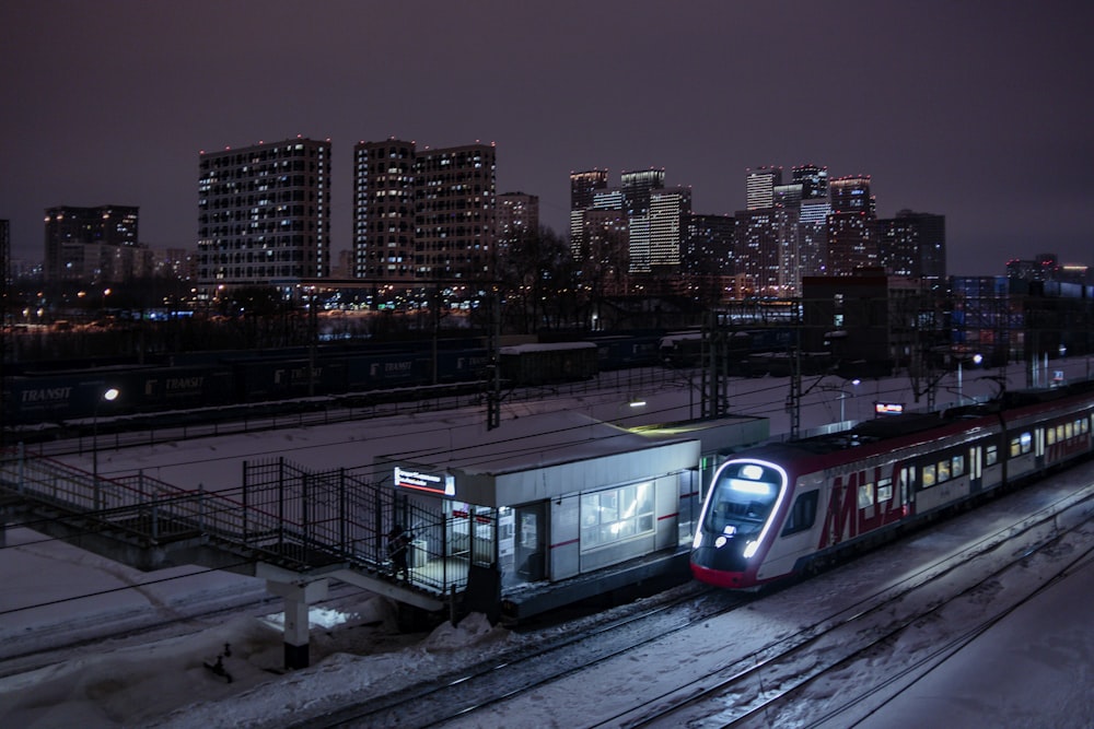 a train traveling through a city at night