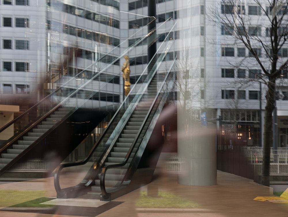 a blurry photo of a woman on an escalator