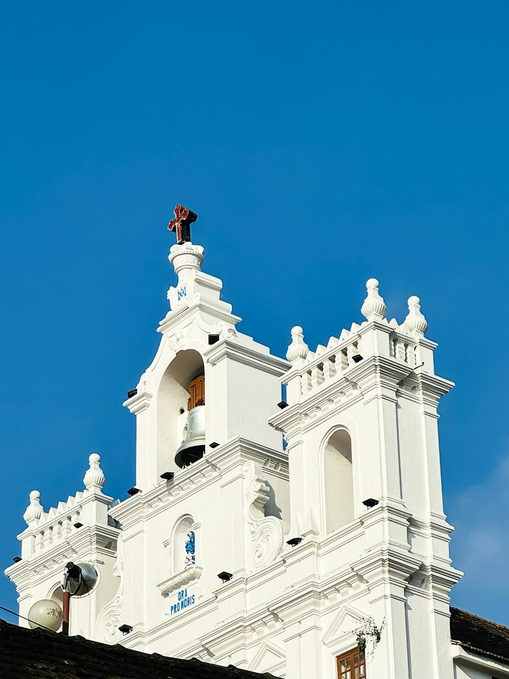 a white building with a cross on top of it