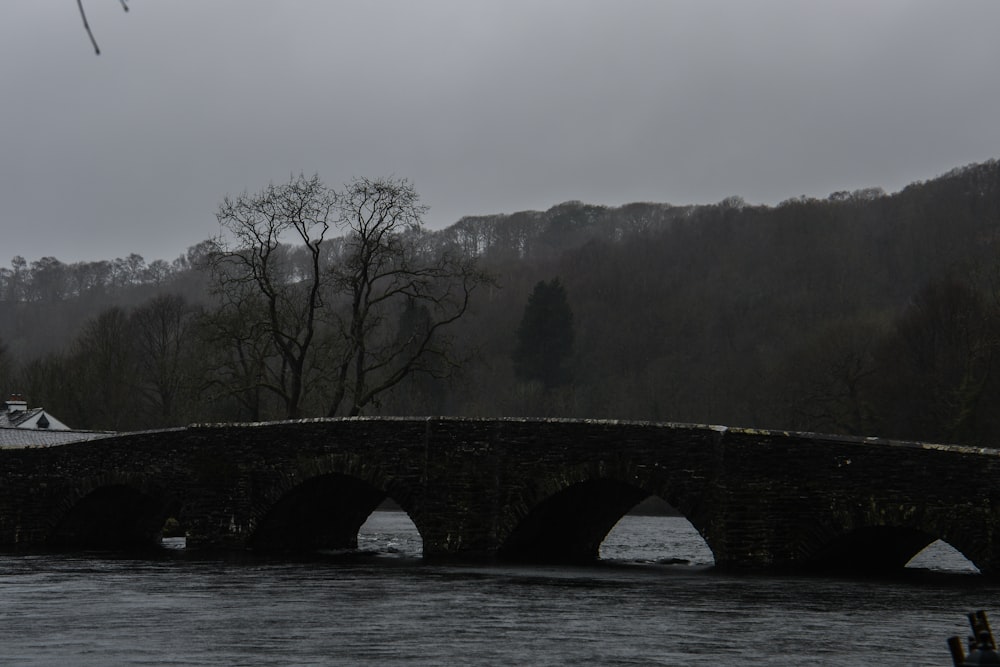 a stone bridge over a body of water