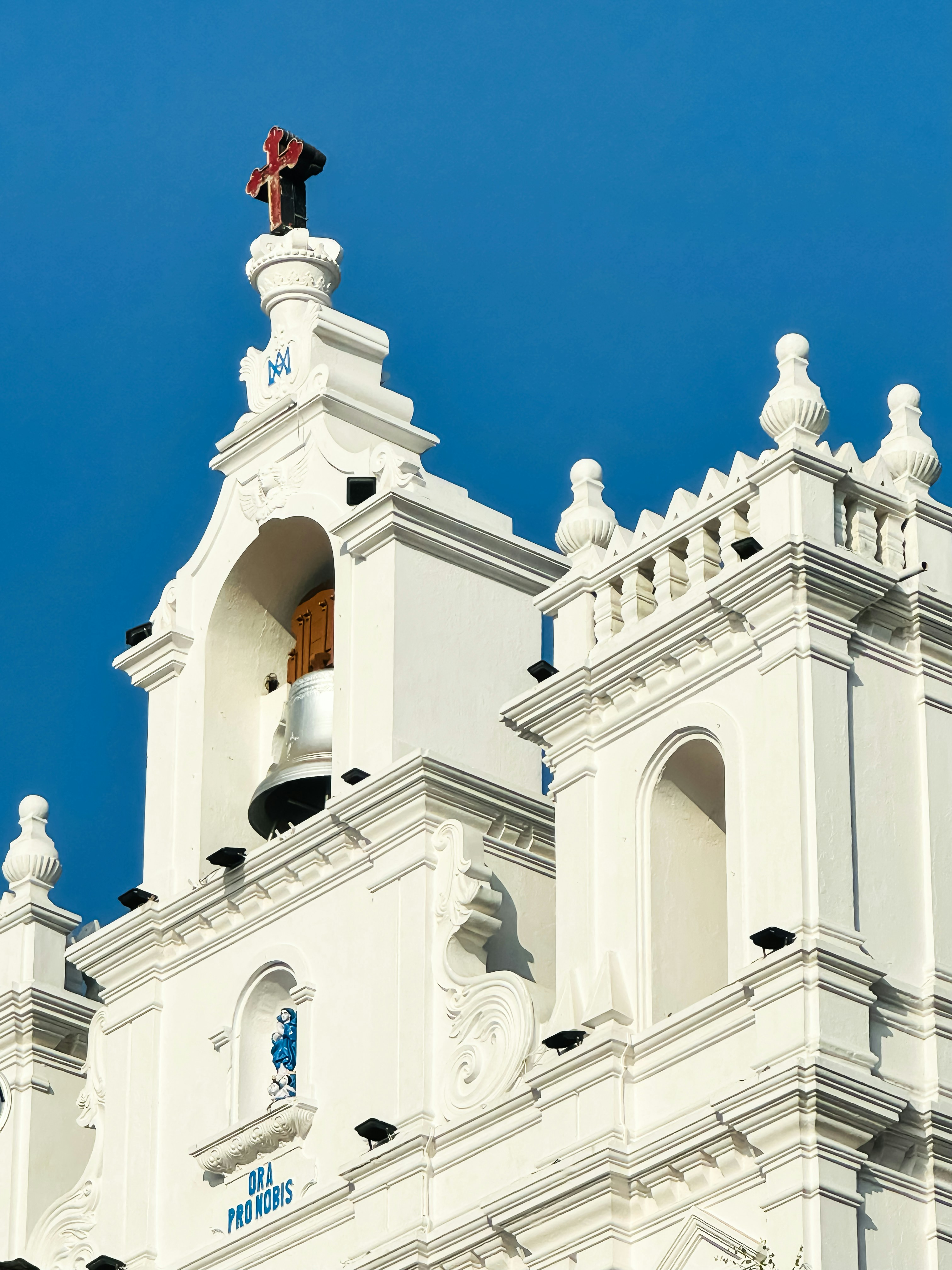 a large white building with a bell tower