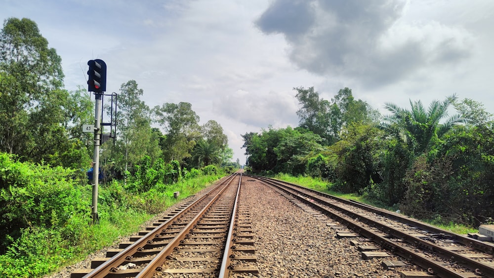 a railroad track with a stop light on it