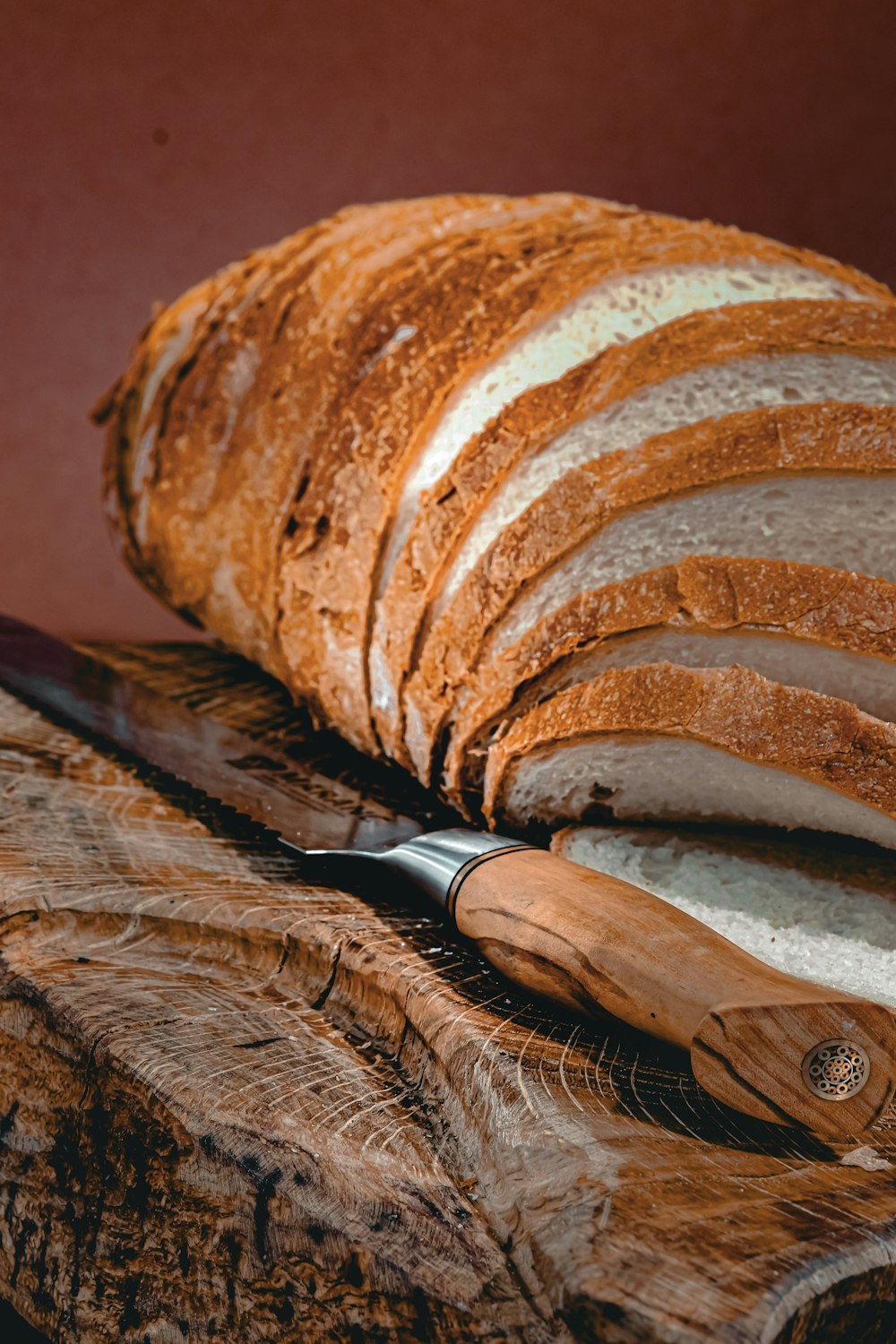 a loaf of bread sitting on top of a cutting board