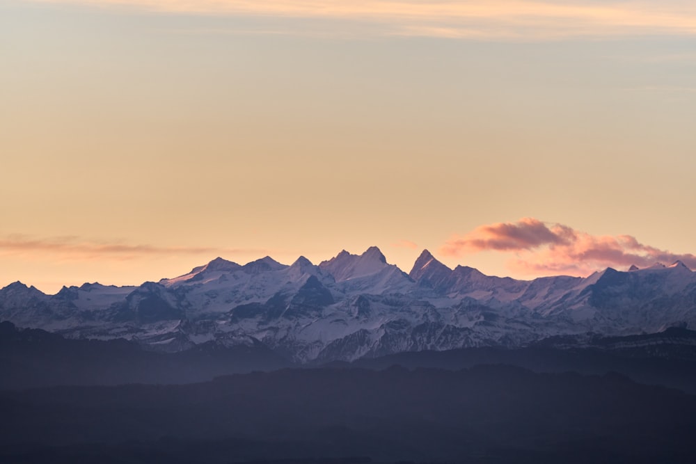 a view of a mountain range at sunset