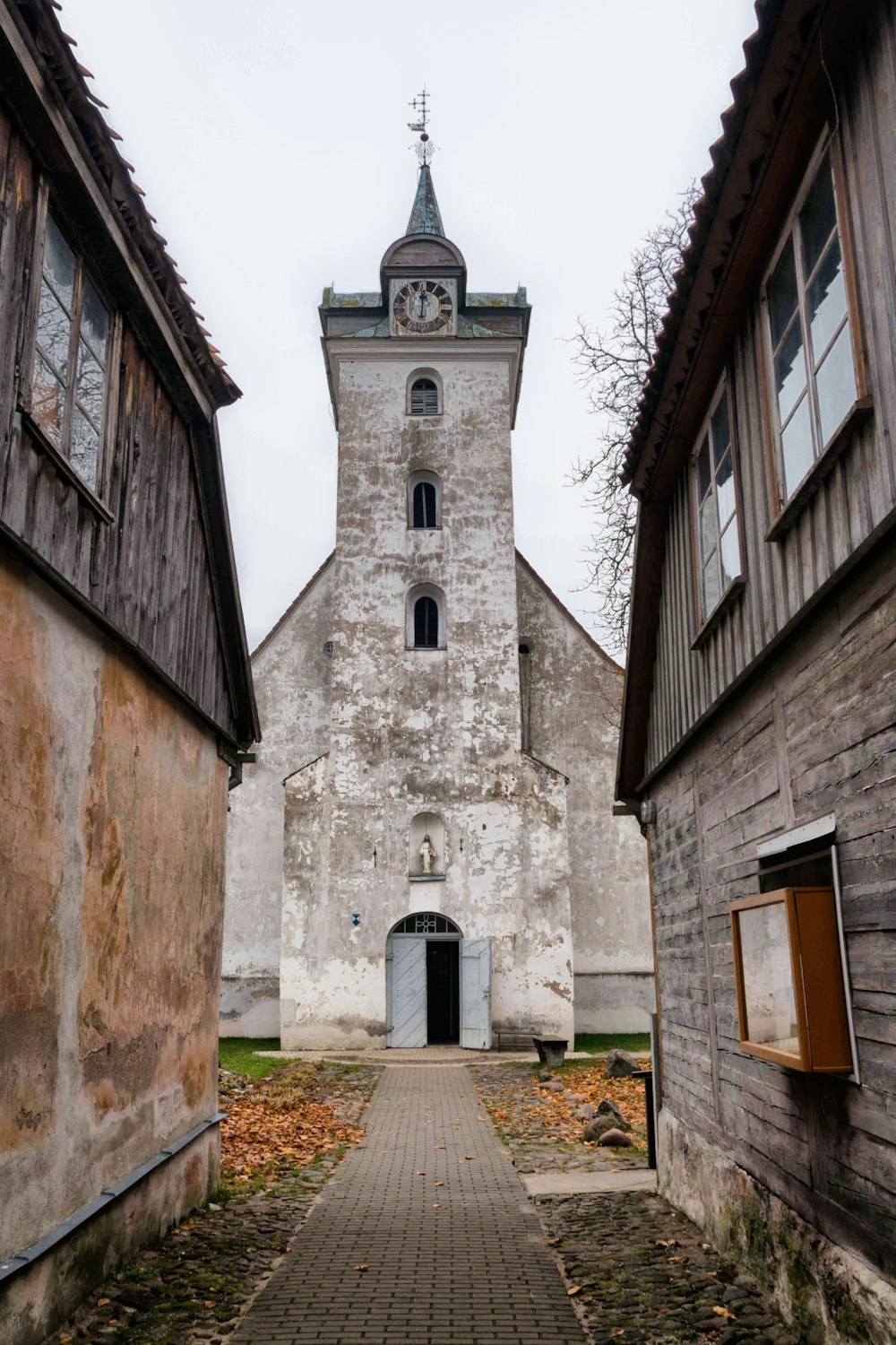 an old building with a clock tower in the middle of it