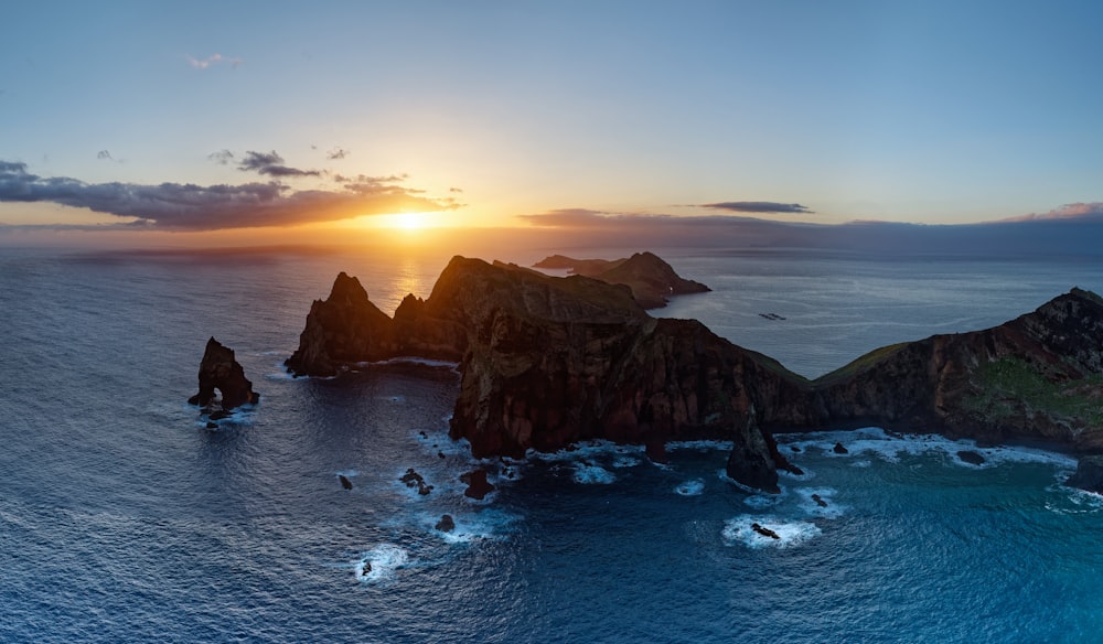 an aerial view of a sunset over the ocean