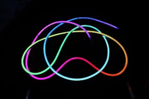 a group of neon lights in the dark