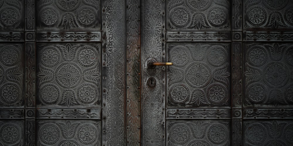 a large metal door with a handle on it