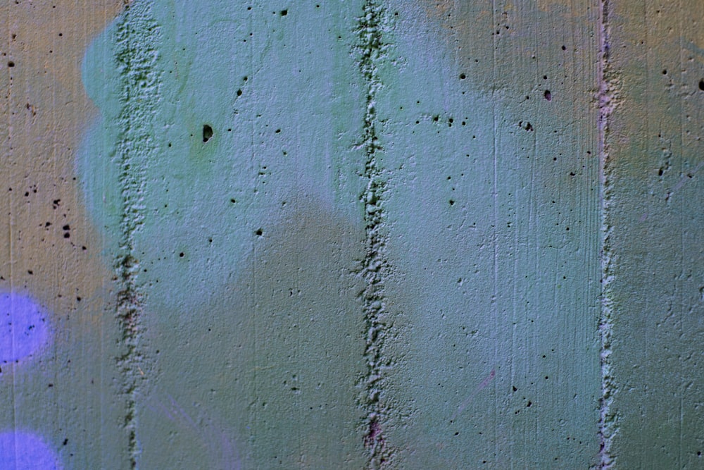 a close up of a wall with a painting on it