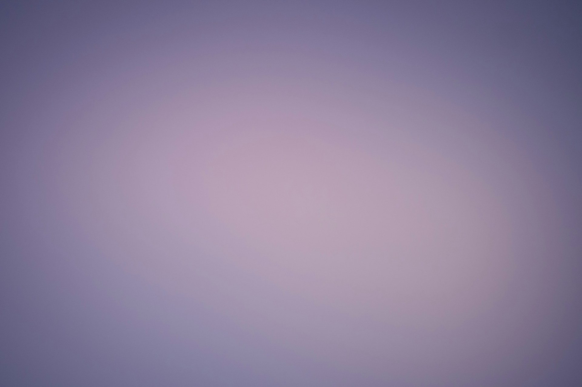 a blurry photo of a plane flying in the sky