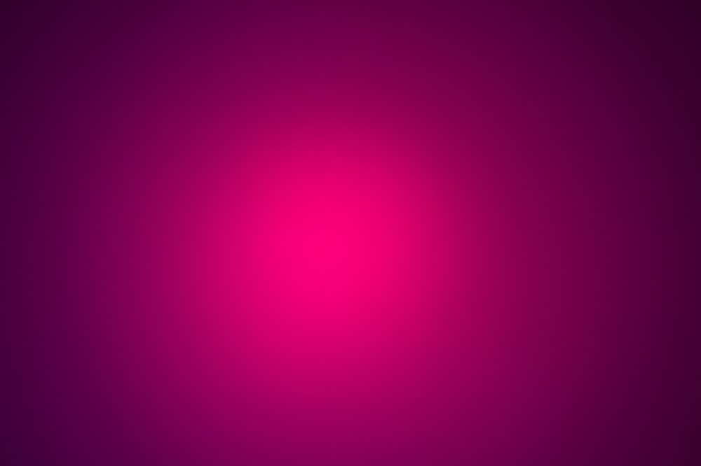 a dark purple background with a red center
