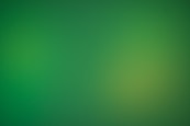 a blurry green background with a white border