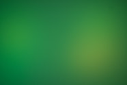 a blurry green background with a white border