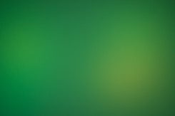 a blurry green background with a white border