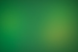 a blurry green background with a white border