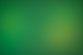 a blurry green background with a white border