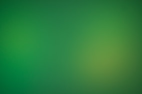 a blurry green background with a white border