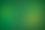 a blurry green background with a white border