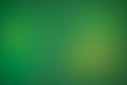 a blurry green background with a white border