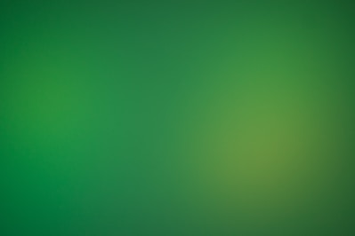 a blurry green background with a white border
