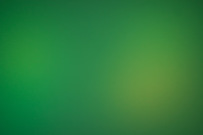 a blurry green background with a white border