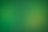 a blurry green background with a white border