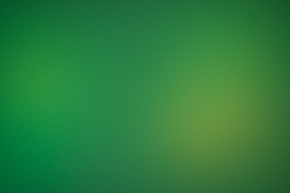 un fondo verde borroso con un borde blanco