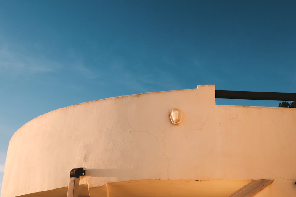 a white building with a light on the side of it