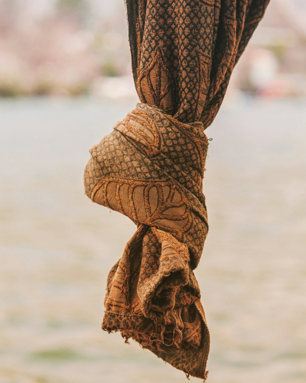 a close up of a cloth hanging from a pole